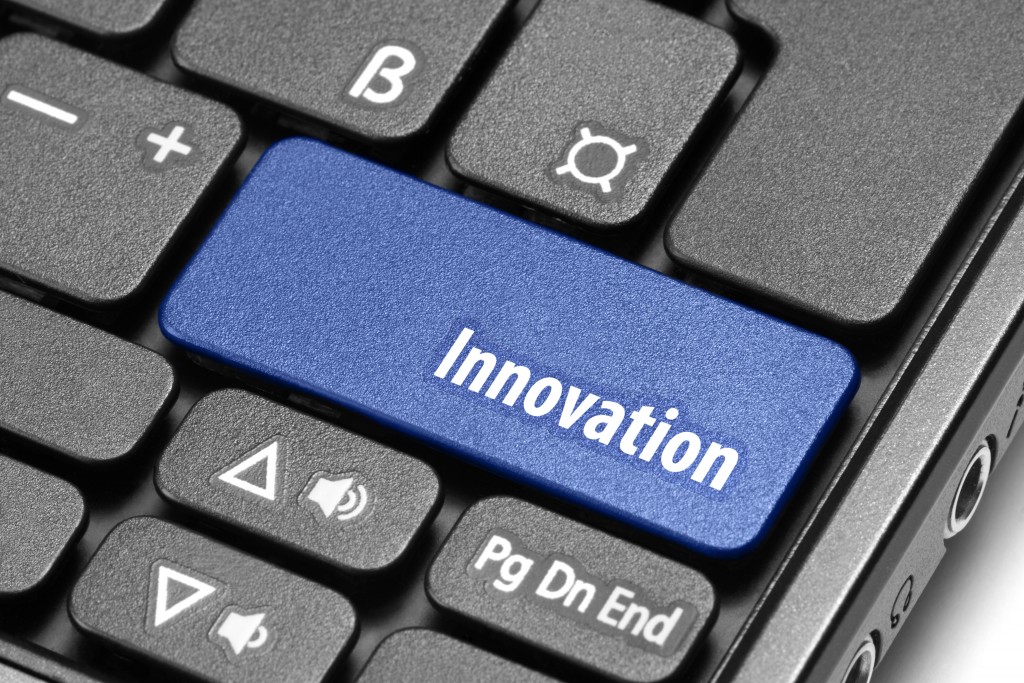 Innovation. Blue hot key on computer keyboard